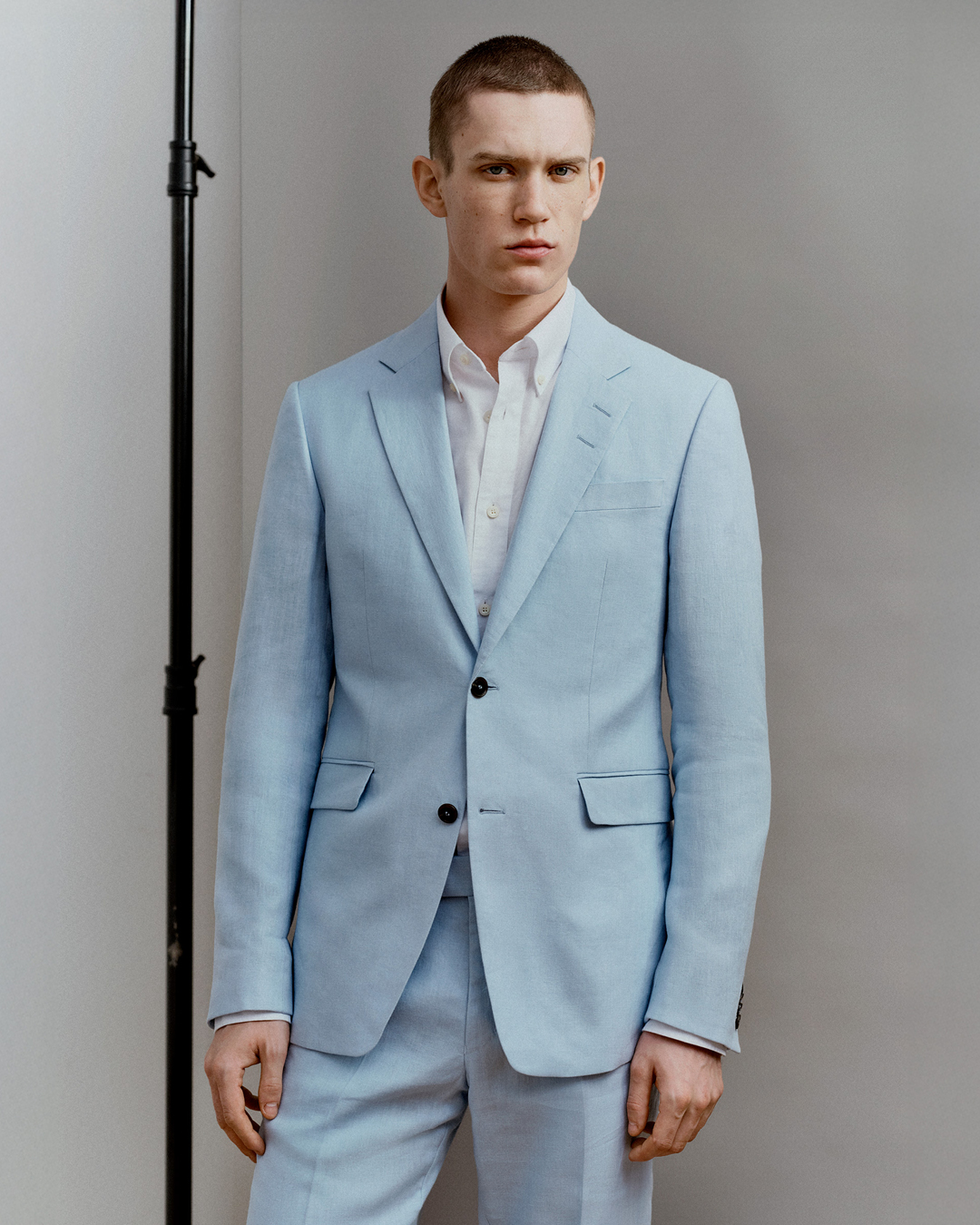 Man in light blue suit